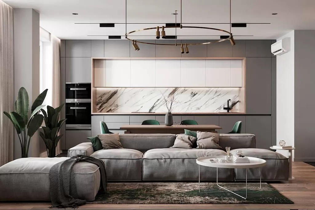 Сучасна вітальня-студія з великим сірим модульним диваном у стилі мінімалізм, мармуровим фартухом на кухні та стильним круглим освітленням
